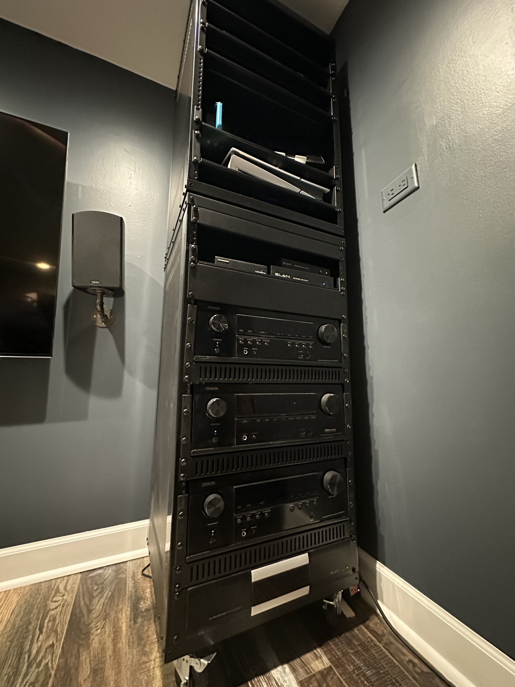 AV equipment rack with stacked Denon receivers and rackmount gear